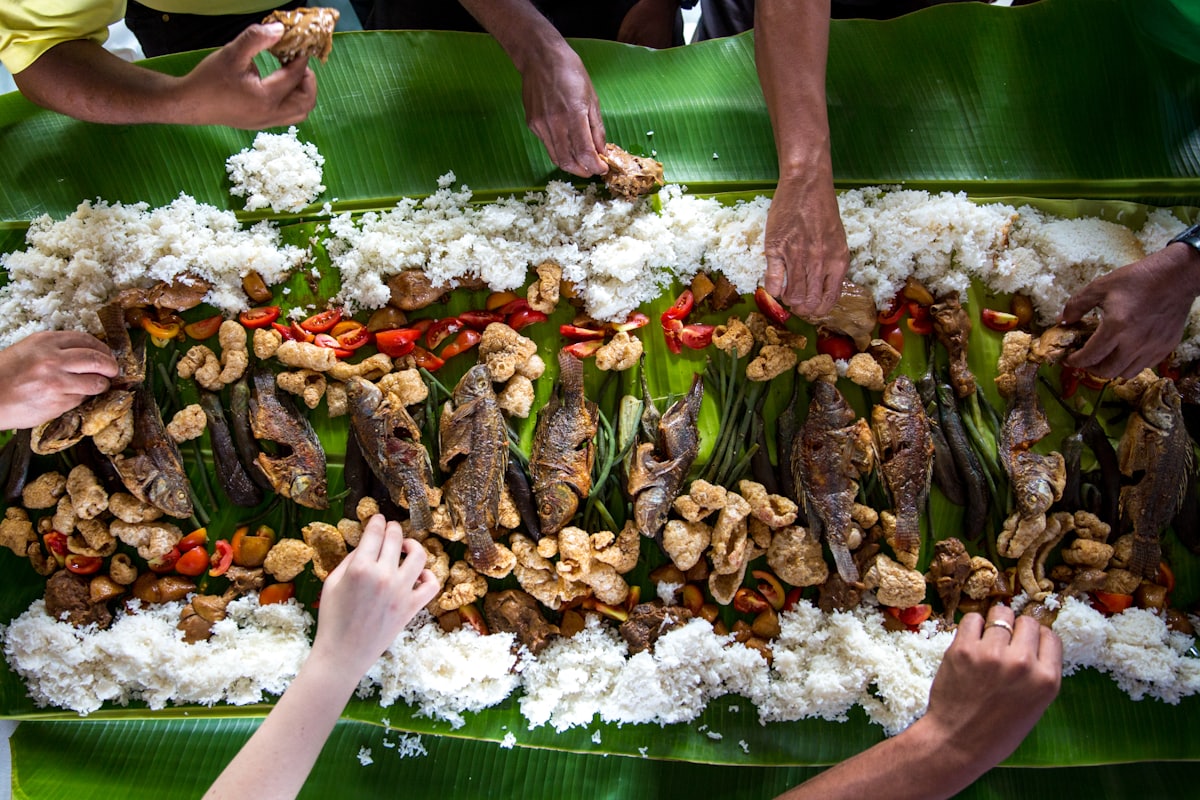 A spread of Filipino dishes served family style on a table
